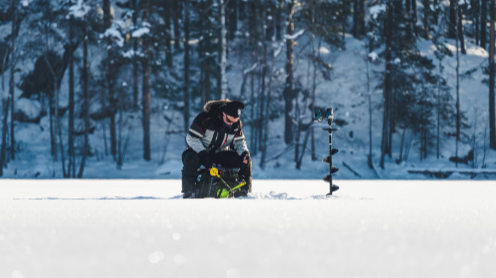 Oravi canal village in winter with lake ice and cottages